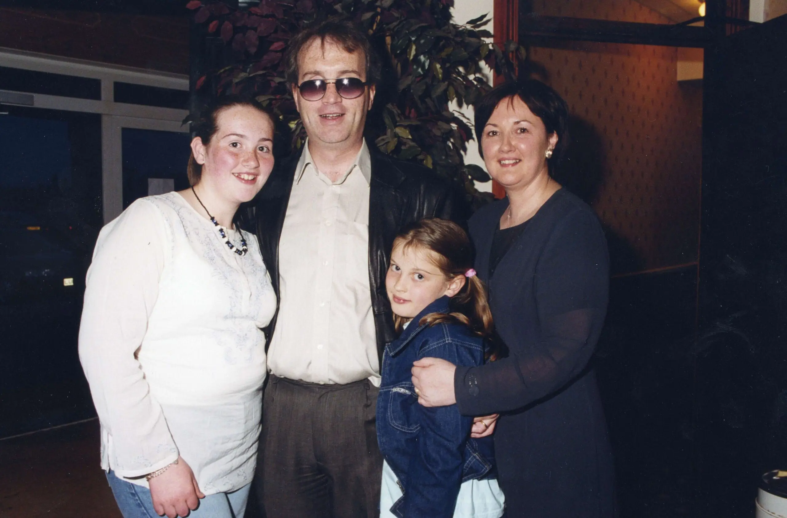 Moore with his wife, Rita, and their daughters, Naoimh and Enya, at his 40th birthday party in Derry, July 2001.