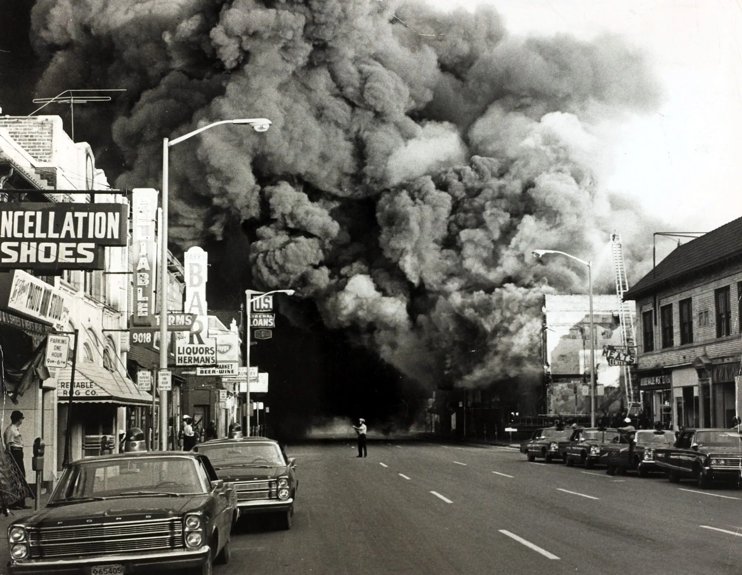 A pall of smoke pours from a burning building during race riots in the Detroit in 1967.