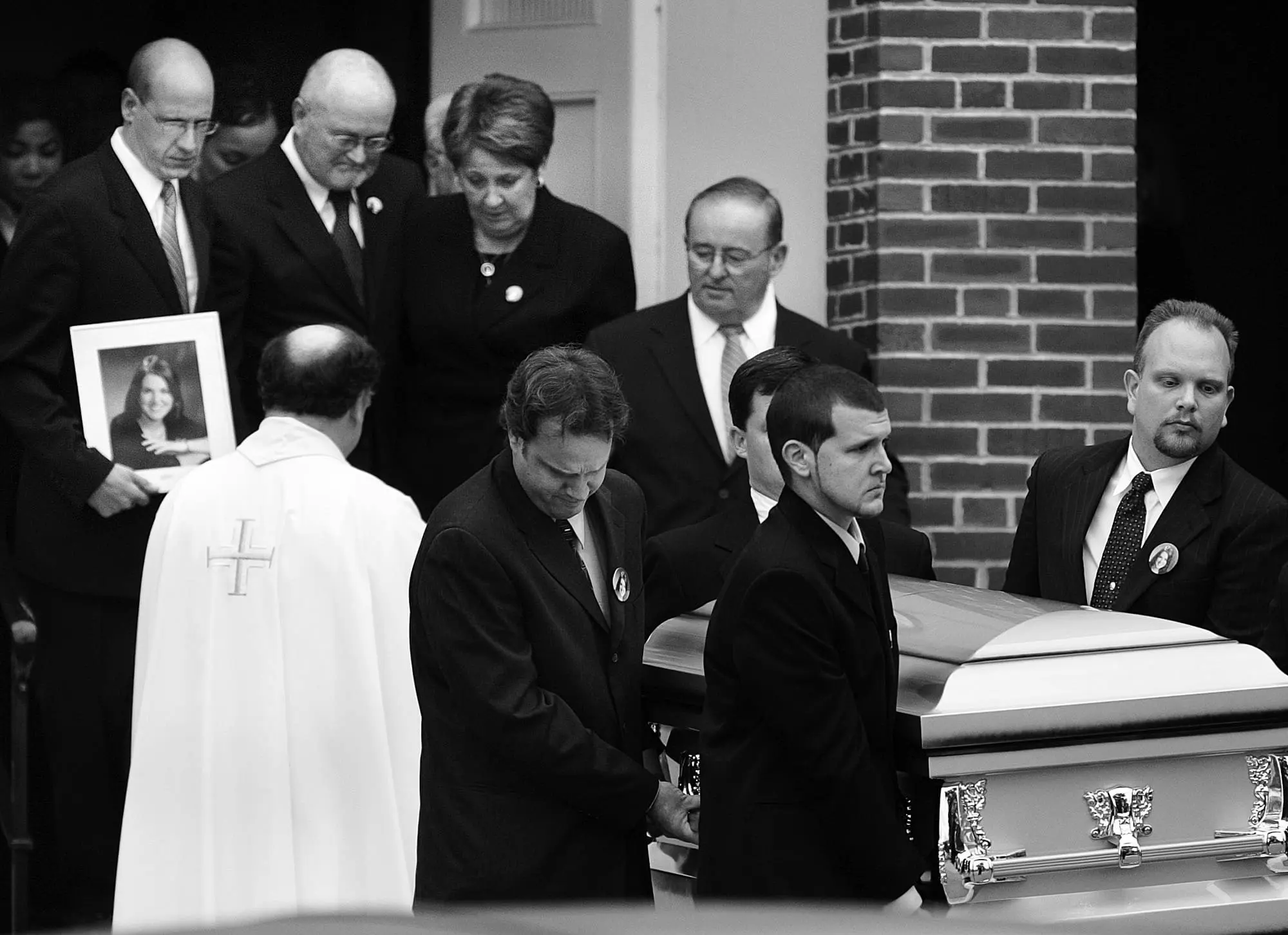 Victoria Snelgrove's family follows her casket out of St. John's Catholic church in East Bridgewater, Mass. after her funeral on Tuesday, Oct. 26, 2004.