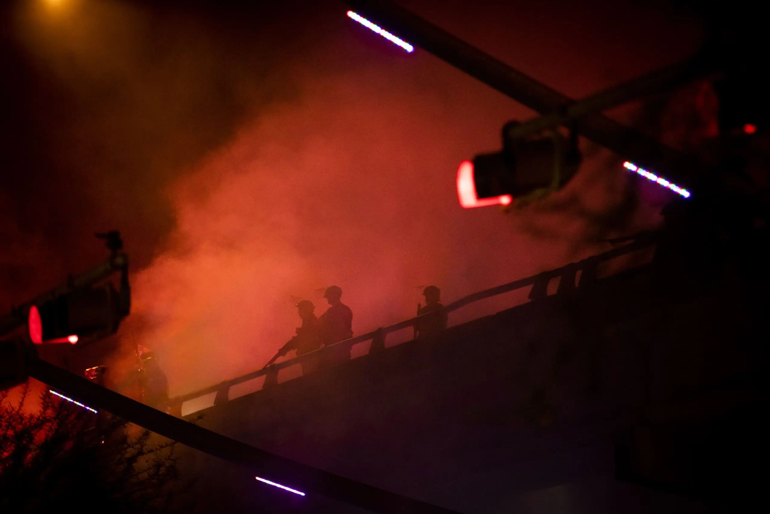 Austin Police officers watch demonstrators from a perch on I-35 on May 30, 2020. Officers occasionally shot into the crowd to disperse protesters.